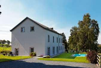Lovely holiday home with an outdoor swimming pool for 12 guests in Gouvy