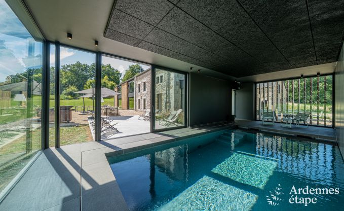 Spacious holiday home on the water in Aubel for 21 people with 9 bedrooms and bathrooms, indoor pool and private garden