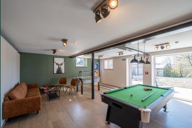 Holiday home in Bastogne: spacious accommodation for 14 people with 6 bedrooms and playroom