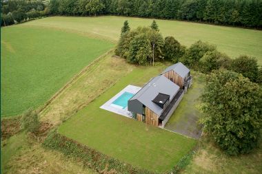 Spacious luxury villa in Bertrix for 16 people with heated outdoor pool and private terrace by the water