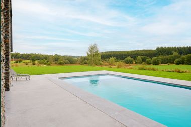 Spacious luxury villa in Bertrix for 16 people with heated outdoor pool and private terrace by the water