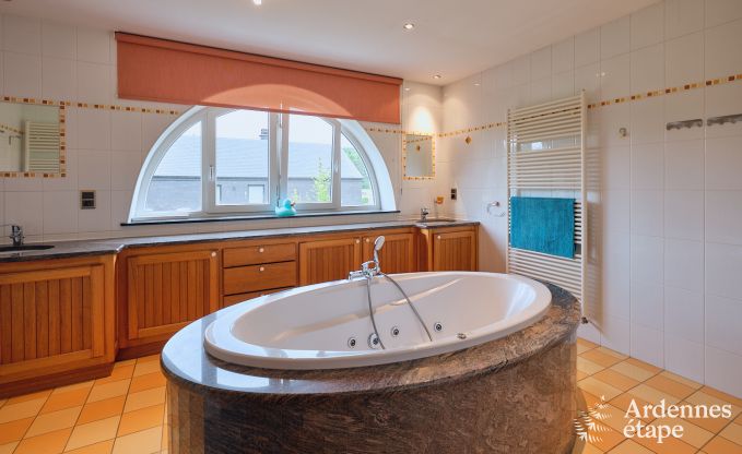 Spacious holiday home consisting of two adjoining buildings in Han-sur-Lesse for 13 people with indoor swimming pool