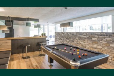 Holiday home for 15 people in Libramont with indoor swimming pool, sauna and private garden by the water