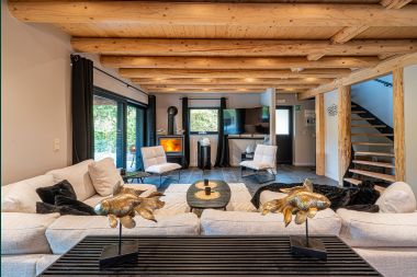 Spacious chalet for 8 people in Trois-Ponts with indoor-outdoor pool, sauna and private terrace by the water