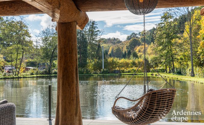 Spacious chalet for 8 people in Trois-Ponts with indoor-outdoor pool, sauna and private terrace by the water