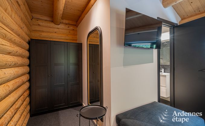 Spacious chalet for 8 people in Trois-Ponts with indoor-outdoor pool, sauna and private terrace by the water