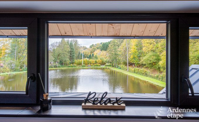 Spacious chalet for 8 people in Trois-Ponts with indoor-outdoor pool, sauna and private terrace by the water