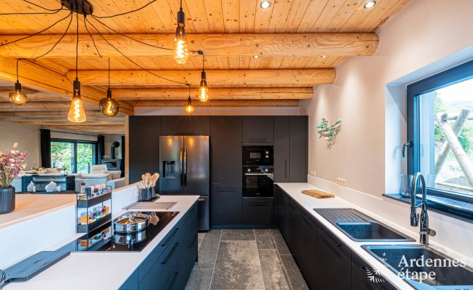 Spacious chalet for 8 people in Trois-Ponts with indoor-outdoor pool, sauna and private terrace by the water